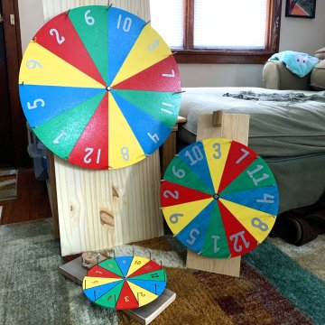 The Completely True Story of How I Ended Up Hanging a Spinning “Prize” Wheel Over My Living Room Window