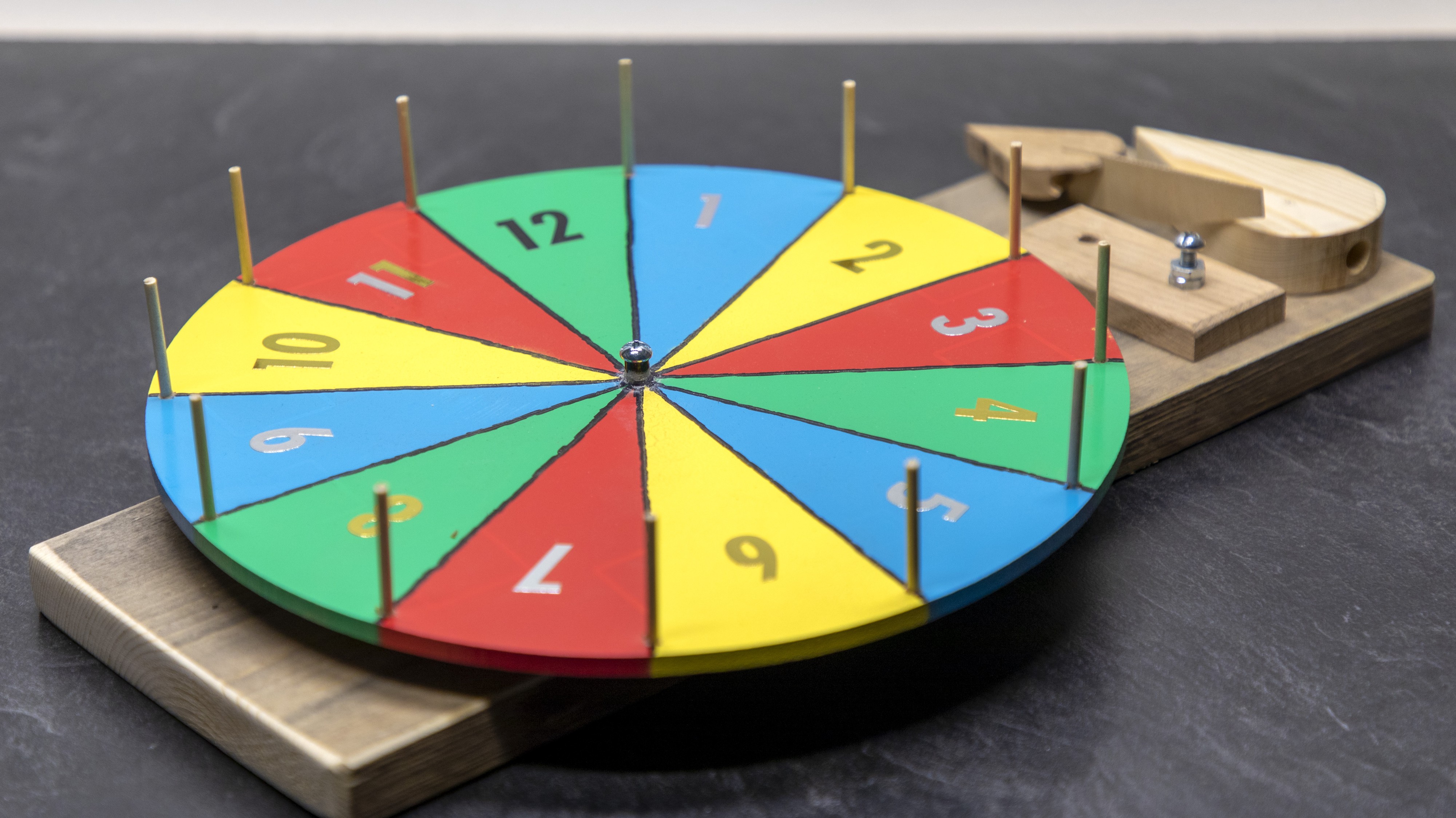The Completely True Story of How I Ended Up Hanging a Spinning “Prize” Wheel Over My Living Room Window